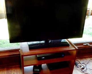 A TV WITH STAND