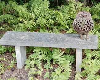 GREAT BENCH AND A MOVABLE METAL OWL.