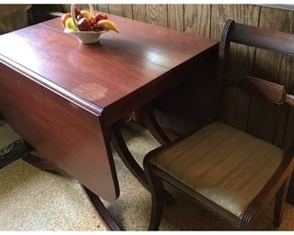 Duncan Phyfe table and 6 chairs(1 arm chair)