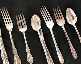 Left:  International Sterling “Joan of Arc” (37 pieces)
Right:  Rogers Brothers Silver-plate “Daffodil” (45 pieces)
Many other flatware pieces collected over the years.