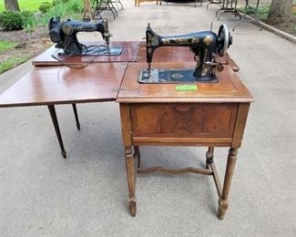Two Vintage sewing machines in Wood Cabinets waiting to find a new home