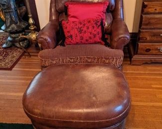 LEATHER CHAIR & OTTOMAN (CHAIR HAS SPLITTING AT TOP SEAM THAT COULD BE REPAIRED)