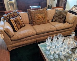 HALF OF SECTIONAL SOFA, WATERFORD STEMWARE, MARBLE COFFEE TABLE