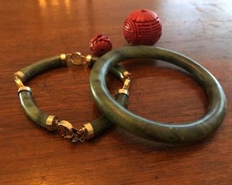 Chinese green jade bracelets and carved cinnabar bead