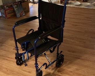 Lightweight, portable folding wheel chair. Adjustable. $50