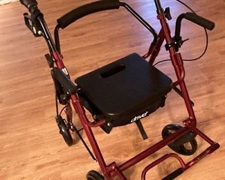 Portable wheeled walker with seat. Mobility aid. New condition. $50