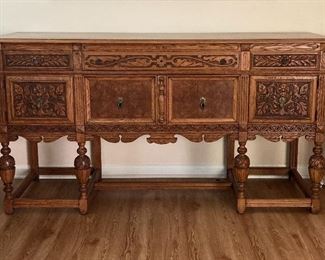Antique Carved Oak Sideboard. Velvet-lined cabinets with wine glass rails. Storage drawers. Solid, beautifully made piece in perfect condition. $800 negotiable