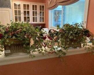 Beautiful faux ivy and roses in unique pottery planters. $15/each