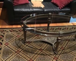 Leather sleep sofa, geo rug, coffee table