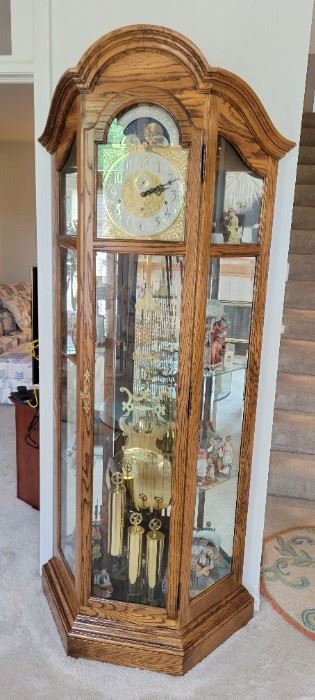 Large Howard Miller grandfather clock, model #610-602, curio cabinet also.  Beautiful condition, runs well.  
36" x 14" x 82" tall