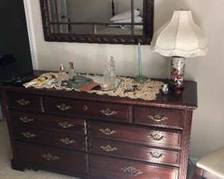 Broyhill woman's dresser.  Antique perfume bottles with stoppers.  Antique lamp.