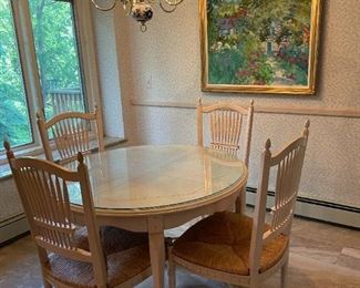 42" Round Wood Kitchenette Table with `1/4 " Glass top and 4 Wood and Rattan Chairs. (I believe there is an additional leaf