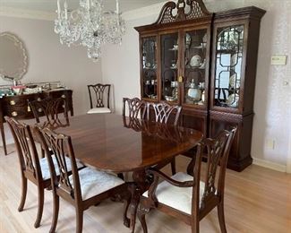 Antique 19th century mahogany Chippendale dining room table with eight chairs and China cabinet