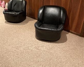 To mid century modern black bucket chairs swivel and rock