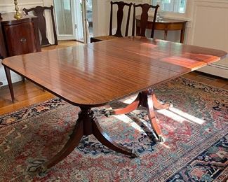 ANTIQUE DOUBLE PEDESTAL DINING TABLE | veneered top, ball and claw feet on casters, with extra leaves (not pictured); h. 29 x 61-1/2 x 46 in. 