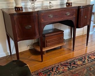 ANTIQUE REGENCY SIDEBOARD | flanked by serpentine-front drawers; h. 37 x 66 x 25 in. 