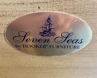 Lot 8200  $495.00 Seven Seas by Hooker, Wine Bar. 24 bottle holders, hanging glass rack, 1 drawer and 2 shelves. 