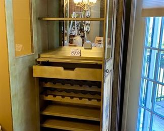 Lot 8200  $495.00 Seven Seas by Hooker, Wine Bar. 24 bottle holders, hanging glass rack, 1 drawer and 2 shelves. 