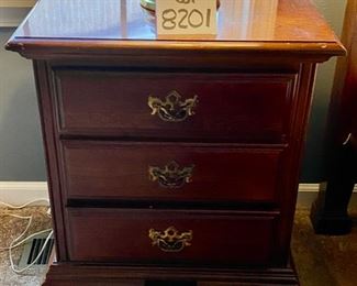 Lot 8201. $1795.00 American Drew Queen Bedroom Set. Includes: Queen Bed and Sealy Posturepedic Mattress (65" W x 88" L x 46" T), posts are 83" T, 2 night stands w/3 drawers (22"W x 15"S x 26"T); Chippendale Tallboy (38"W x 19"D x 84"T) 9 drawers and 1 pull (broken, but included).