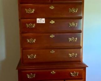 Lot 8201. $1795.00 American Drew Queen Bedroom Set. Includes: Queen Bed and Sealy Posturepedic Mattress (65" W x 88" L x 46" T), posts are 83" T, 2 night stands w/3 drawers (22"W x 15"S x 26"T); Chippendale Tallboy (38"W x 19"D x 84"T) 9 drawers and 1 pull (broken, but included).