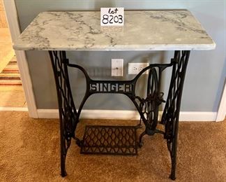 Lot 8203. $225.00 Wrought Iron "Singer" Treadle base with marble top. Super Cute Table. 31.5" W x 17" L x 28.5" T