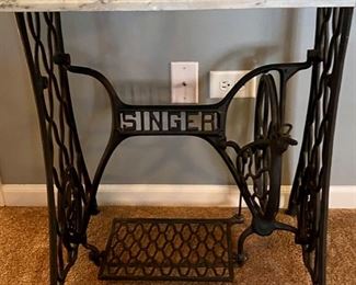 Lot 8203. $225.00 Wrought Iron "Singer" Treadle base with marble top. Super Cute Table. 31.5" W x 17" L x 28.5" T