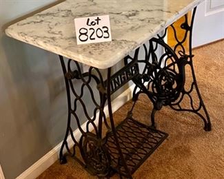 Lot 8203. $225.00 Wrought Iron "Singer" Treadle base with marble top. Super Cute Table. 31.5" W x 17" L x 28.5" T