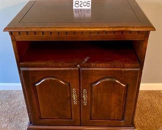 Lot 8205. $60.00. Swivel Top TV Cabinet with pull out component shelf, blemishes as shown. 27.5" L x 17" W x 31" T