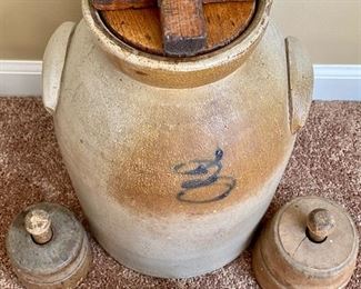 Lot 8213. $150.00 Antique Salt Glazed Butter Churn/Crock with lid and paddle bottom, appears to be a #3 in script on front, No Paddle Stick, and 2 antique wood butter molds/stamps 14" T x 10"diam. Normal Used Condition; displays great and very cool butter molds as well.