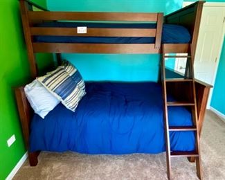 Lot 8221 $400.00. Very Cool Peligro Walnut Stain Bunk Bed (Twin Over Full) with complte Bedding and Ladder... 80" L x 74" T. 60" W and 45" W.