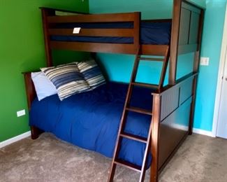 Lot 8221 $400.00. Very Cool Peligro Walnut Stain Bunk Bed (Twin Over Full) with complte Bedding and Ladder... 80" L x 74" T. 60" W and 45" W.