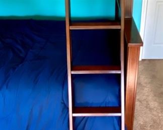 Lot 8221 $400.00. Very Cool Peligro Walnut Stain Bunk Bed (Twin Over Full) with complte Bedding and Ladder... 80" L x 74" T. 60" W and 45" W.