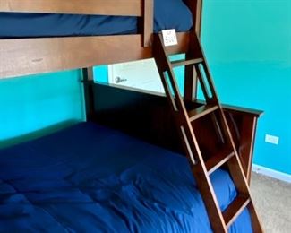 Lot 8221 $400.00. Very Cool Peligro Walnut Stain Bunk Bed (Twin Over Full) with complte Bedding and Ladder... 80" L x 74" T. 60" W and 45" W.