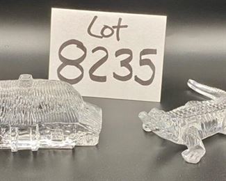 Lot 8235. $80.00. 2 Waterford Crystal Figurines: 1) Waterford Lismore Village Cottage (3 5/8" L x 2" W x 1 1/2" D) and 2) Waterford Crystal Alligator, retired and 5" long
