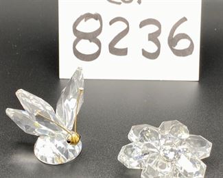 Lot 8236. $75.00. 2 Swarovski Crystal Figurines, a 2" butterfly and a floral cake stand (2 1/8" across)