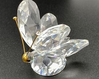 Lot 8236. $75.00. 2 Swarovski Crystal Figurines, a 2" butterfly and a floral cake stand (2 1/8" across)