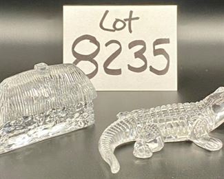 Lot 8235. $80.00. 2 Waterford Crystal Figurines: 1) Waterford Lismore Village Cottage (3 5/8" L x 2" W x 1 1/2" D) and 2) Waterford Crystal Alligator, retired and 5" long