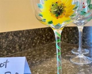 Lot 8230. $30.00. 5 hand painted wine glasses, 4 are poinsettia themed and one sunflower glass. Super Sweet!!