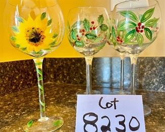 Lot 8230. $30.00. 5 hand painted wine glasses, 4 are poinsettia themed and one sunflower glass. Super Sweet!!