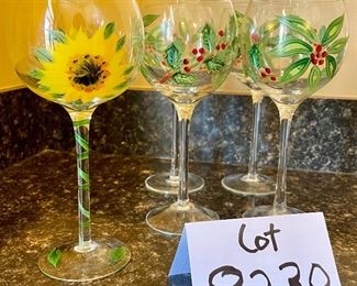 Lot 8230. $30.00. 5 hand painted wine glasses, 4 are poinsettia themed and one sunflower glass. Super Sweet!!
