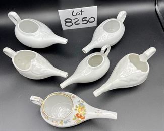 Lot 8250. $50.00 Lot of 6 elongated porcelain, infant/hospital/invalid feeders. 1) Gold trim, floral design, 2) Scalloped edge with cool details, signed "H", 3) White, unsigned, 4) #2830, white, 5) 2985, white , repair on handle,6) #8250 white w/leaf on top.