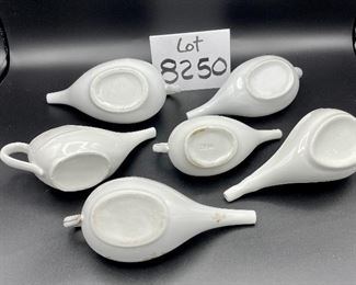 Lot 8250. $50.00 Lot of 6 elongated porcelain, infant/hospital/invalid feeders. 1) Gold trim, floral design, 2) Scalloped edge with cool details, signed "H", 3) White, unsigned, 4) #2830, white, 5) 2985, white , repair on handle,6) #8250 white w/leaf on top.