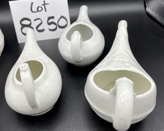 Lot 8250. $50.00 Lot of 6 elongated porcelain, infant/hospital/invalid feeders. 1) Gold trim, floral design, 2) Scalloped edge with cool details, signed "H", 3) White, unsigned, 4) #2830, white, 5) 2985, white , repair on handle,6) #8250 white w/leaf on top.