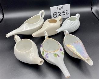 Lot 8252. $30.00 Lot of 6 vintage infant/hospital/invalid feeders. 1) Floral design, 2) Pearlescent glaze, 3) Homer Laughling stone china with crazing, 4) Marked 'Made in England', 5) cream color with smooth lines, 6) White with ribbed detail marked 'Paris, France'