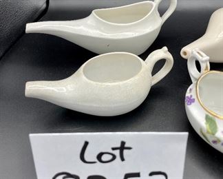 Lot 8252. $30.00 Lot of 6 vintage infant/hospital/invalid feeders. 1) Floral design, 2) Pearlescent glaze, 3) Homer Laughling stone china with crazing, 4) Marked 'Made in England', 5) cream color with smooth lines, 6) White with ribbed detail marked 'Paris, France'