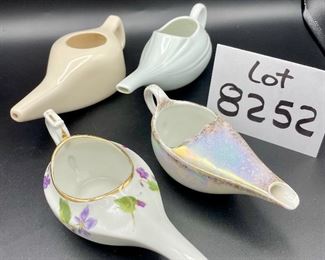 Lot 8252. $30.00 Lot of 6 vintage infant/hospital/invalid feeders. 1) Floral design, 2) Pearlescent glaze, 3) Homer Laughling stone china with crazing, 4) Marked 'Made in England', 5) cream color with smooth lines, 6) White with ribbed detail marked 'Paris, France'