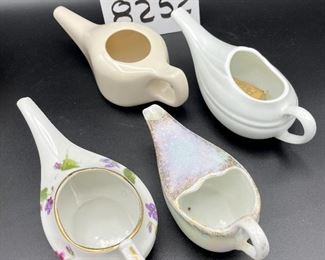Lot 8252. $30.00 Lot of 6 vintage infant/hospital/invalid feeders. 1) Floral design, 2) Pearlescent glaze, 3) Homer Laughling stone china with crazing, 4) Marked 'Made in England', 5) cream color with smooth lines, 6) White with ribbed detail marked 'Paris, France'