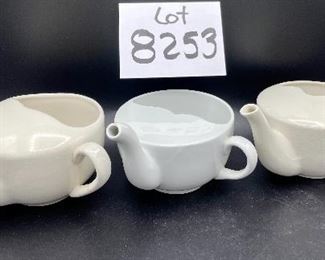 Lot 8253. $60.00 Lot of 9 white and cream colored self-feeders.