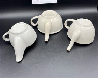 Lot 8253. $60.00 Lot of 9 white and cream colored self-feeders.