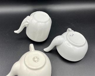 Lot 8253. $60.00 Lot of 9 white and cream colored self-feeders.